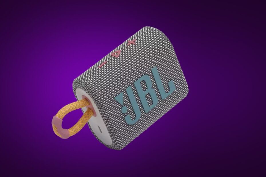 foto da caixa de som ultra compacta JBL GO 3 em um background roxo do Lista Tech
